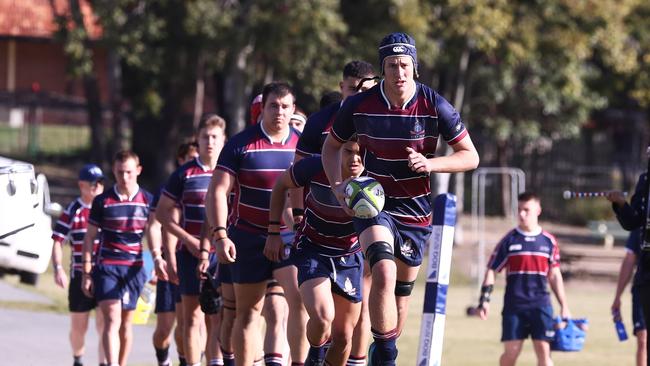 Michael van der Schyff of TSS leads out the team against BBC during their GPS Rugby clash. Photograph : Jason O'Brien