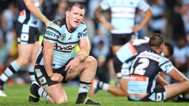 Paul Gallen and the Sharks look on after their loss to the Cowboys.