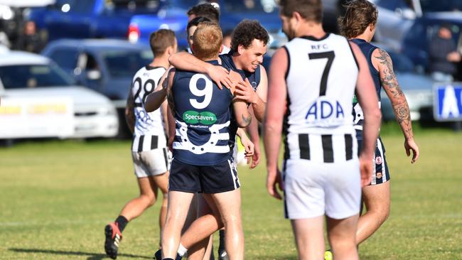 Troy Johnson (number nine) enjoying a team goal for Noarlunga. Picture: AAP/Keryn Stevens