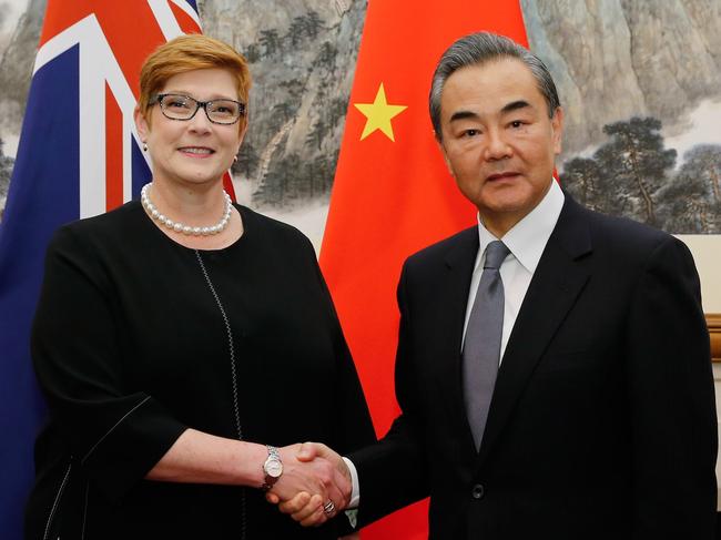 Australia's Foreign Minister Marise Payne (L) shakes hands with her Chinese counterpart Wang Yi at the Diaoyutai State Guesthouse in Beijing on November 8, 2018. (Photo by THOMAS PETER / POOL / AFP)