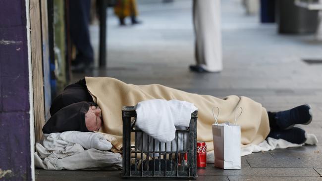 A man sleeping rough on Oxford St in Darlinghurst. Picture: Richard Dobson