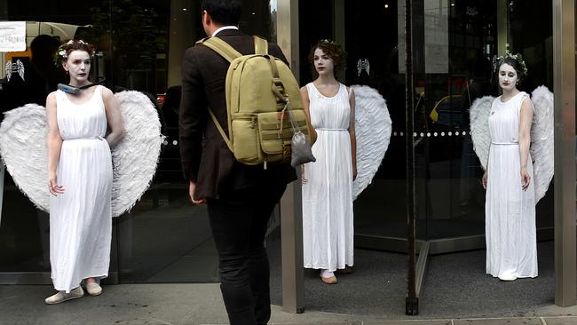 Climate angels stage protest outside AGL building Herald Sun