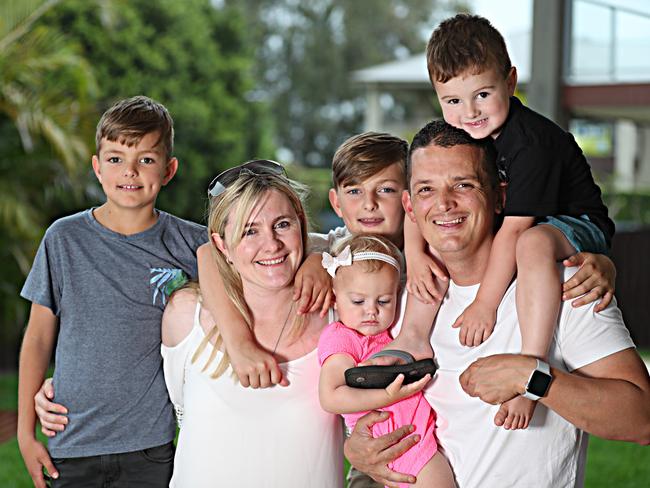 Leanne and Ashley Eksteen with kids Kayla, 1, Connor, 3s , Tristan, 10, and Keegan, 12, at their new home in North Lakes. Picture: Annette Dew