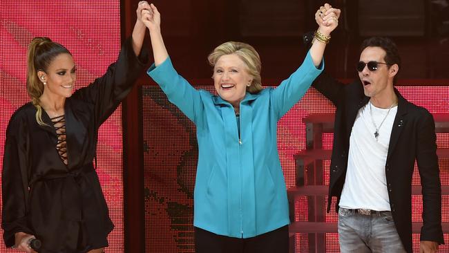 Jennifer Lopez, Hillary Clinton and Lopez’s former husband Marc Anthony are seen at the Jennifer Lopez Gets Loud for Hillary Clinton event in Miami in October. Picture: Gustavo Caballero / Getty