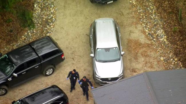 Aerial images show detectives outside the home. Picture: NCA Newswire