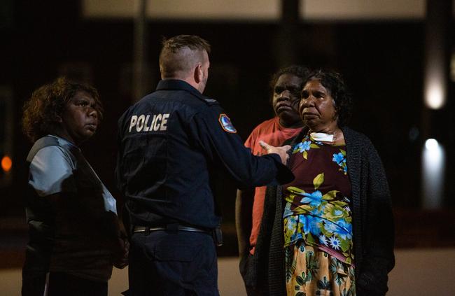 The family Kumunjayi Walker question a police officer at the Alice Springs Hospital late on Saturday night, hoping to find out if he was still alive. Picture: EMMA MURRAY