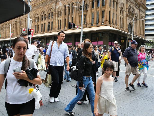 SYDNEY, AUSTRALIA : NewsWire Photos - DECEMBER 02 2024; Busy shoppers are seen walking across George Street in the Sydney CBD as Retail stores are now decorated with Christmas decorations and filled with special sales four weeks till Christmas. Picture: NewsWire / Gaye Gerard