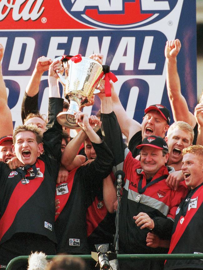 Kevin Sheedy and Essendon players lift the premiership cup in 2000.