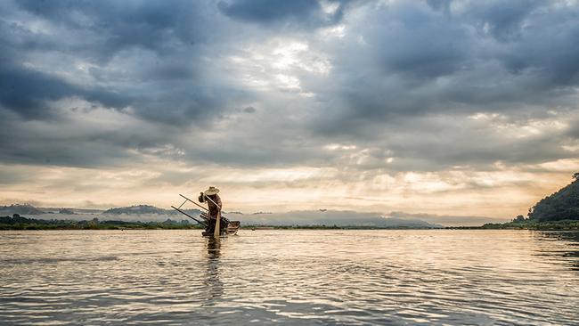 A fisherman on the Mekong River, Vietnam.