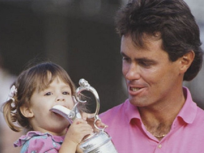 A younger Ian Baker-Finch with his young daughter and the famous British Open Trophy win in 1991.