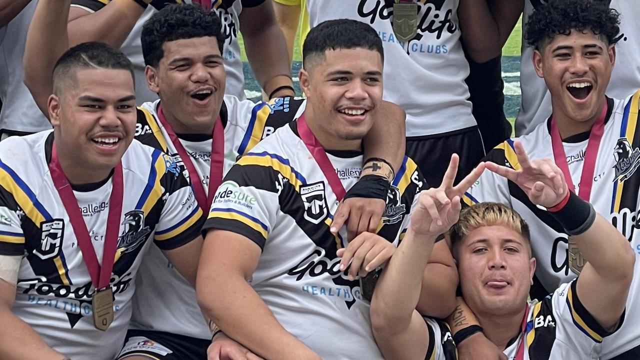 Happy days for Souths Logan’s Tre Fotu, left, of Ipswich SHS and Chris Faagutu (Marsden SHS captain) earlier in the season.