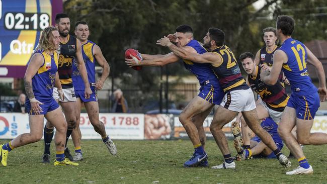 EFL: Noble Park’s Jordan Marson tries to get his arms free. Picture: Valeriu Campan