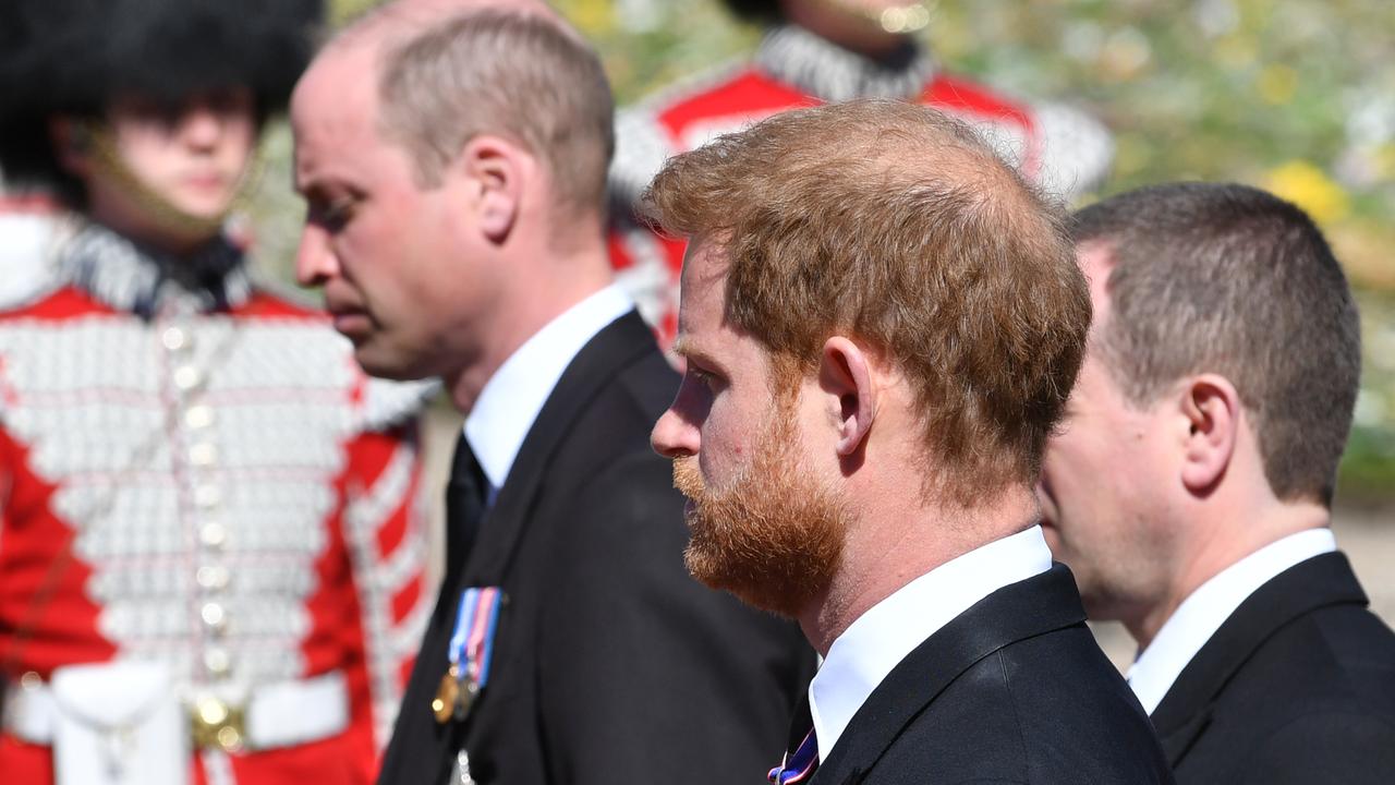 A grim-faced Prince William and brother Prince Harry walk with Peter Phillips behind the Duke of Edinburgh’s Land Rover hearse Picture: Mark Large/Getty Images