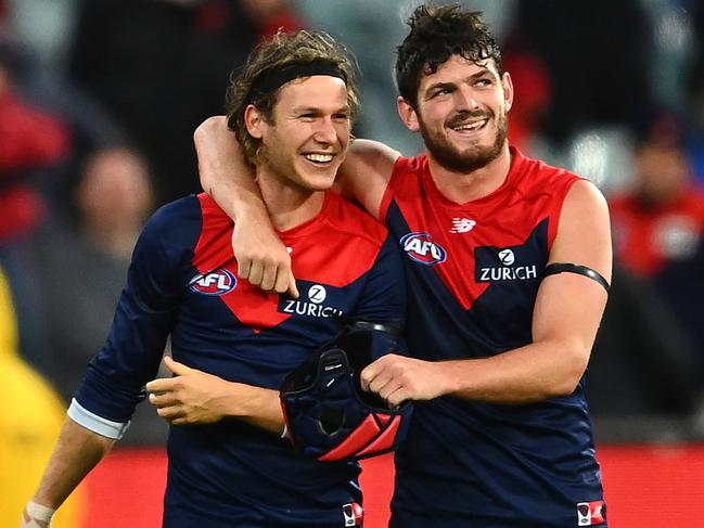 MELBOURNE, AUSTRALIA - APRIL 11: Ed Langdon and Angus Brayshaw of the Demons celebrate winning the round four AFL match between the Melbourne Demons and the Geelong Cats at Melbourne Cricket Ground on April 11, 2021 in Melbourne, Australia. (Photo by Quinn Rooney/Getty Images)