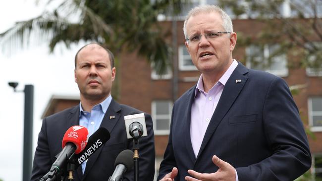 Prime Minister Scott Morrison and Treasurer Josh Freydenberg front the media at Kirribilli House on Saturday morning. Picture: David Swift.