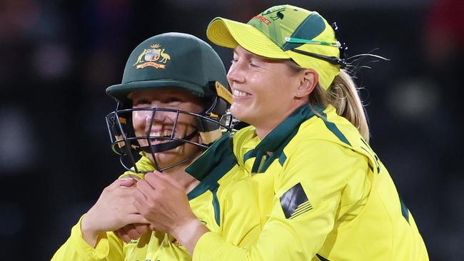 CHRISTCHURCH, NEW ZEALAND - APRIL 03: Alyssa Healy (L) and Meg Lanning of Australia celebrate after winning the 2022 ICC Women's Cricket World Cup Final match between Australia and England at Hagley Oval on April 03, 2022 in Christchurch, New Zealand. (Photo by Peter Meecham/Getty Images)