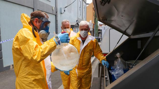 Police working inside a clandestine drug lab. Picture: Alex Coppel.