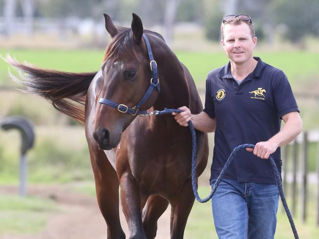 Ben Ahrens with Chillin with Dylan at his stables in Beaudesert. Pic Jono Searle.