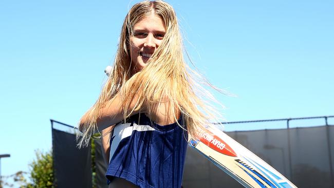 Eugenie Bouchard poses with a cricket bat.