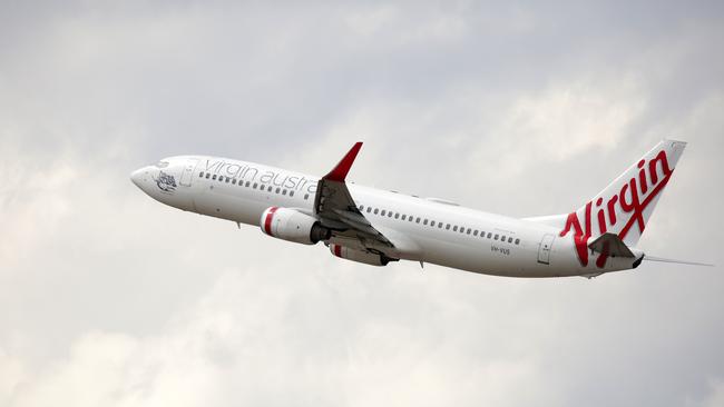 Five more cases are linked to a Virgin flight. Picture: NCA NewsWire / Christian Gilles