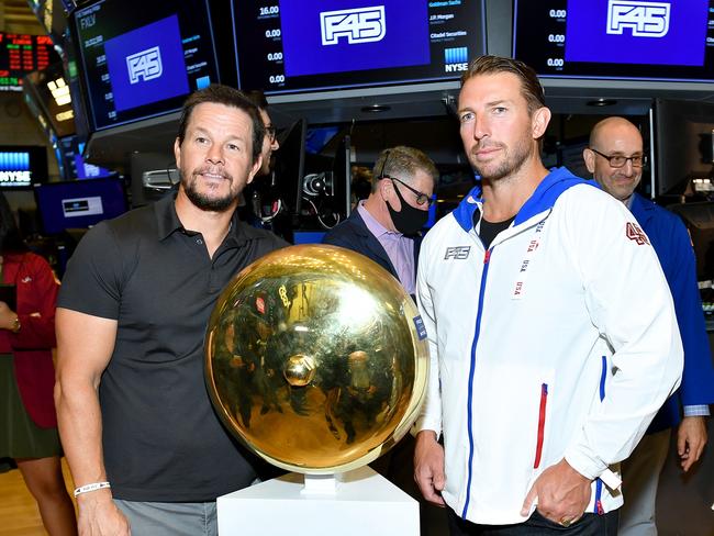 Mark Wahlberg and F45 Founder and CEO Adam Gilchrist pose on the trading floor the company lists on the NYSE. Picture: Getty