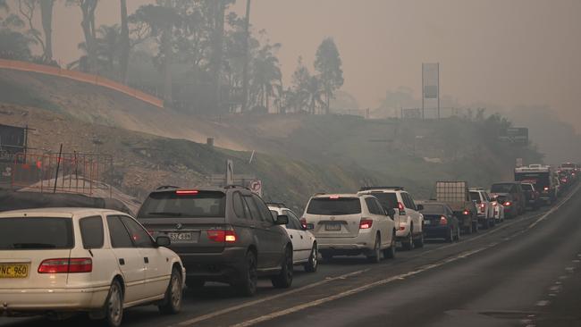 Residents and holiday-makers leaving Batemans Bay on January 2. The bushfires will cost the region cost the region ­hundreds of millions in tourism dollars. Picture: Peter Parks