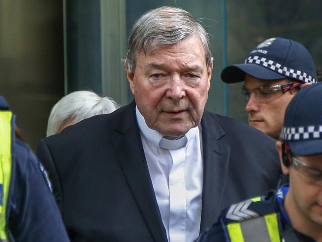 FILE - In this May 2, 2018, file photo, Cardinal George Pell, the most senior Catholic cleric to face sex charges, leaves court in Melbourne, Australia. Pell was sentenced in an Australian court on Wednesday, March 13, 2019 to 6 years in prison for molesting two choirboys in a Melbourne cathedral more than 20 years ago.  (AP Photo/Asanka Brendon Ratnayake, File)