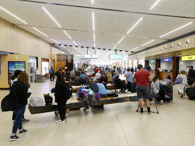 CHECK-IN: Arrivals to Hobart Airport register travel details and contacts. Picture: MATT THOMPSON