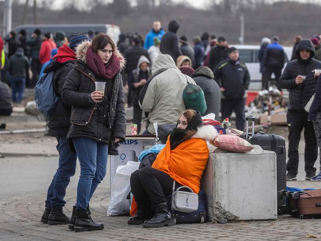 Ukrainian citizens arrive at the Medyka pedestrian border crossing in Poland after fleeing the conflict in their country. Picture: AFP