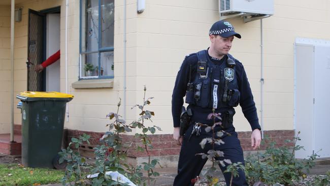 SA Police at Mellor Court in Gilberton where a man was allegedly murdered in June. Picture: Emma Brasier