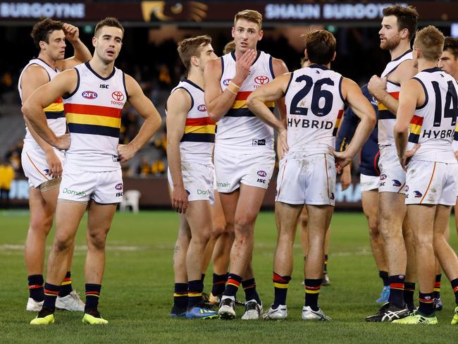 MELBOURNE, AUSTRALIA - JUNE 16: Crows players look dejected after a loss during the 2018 AFL round 13 match between the Hawthorn Hawks and the Adelaide Crows at the Melbourne Cricket Ground on June 16, 2018 in Melbourne, Australia. (Photo by Adam Trafford/AFL Media/Getty Images)