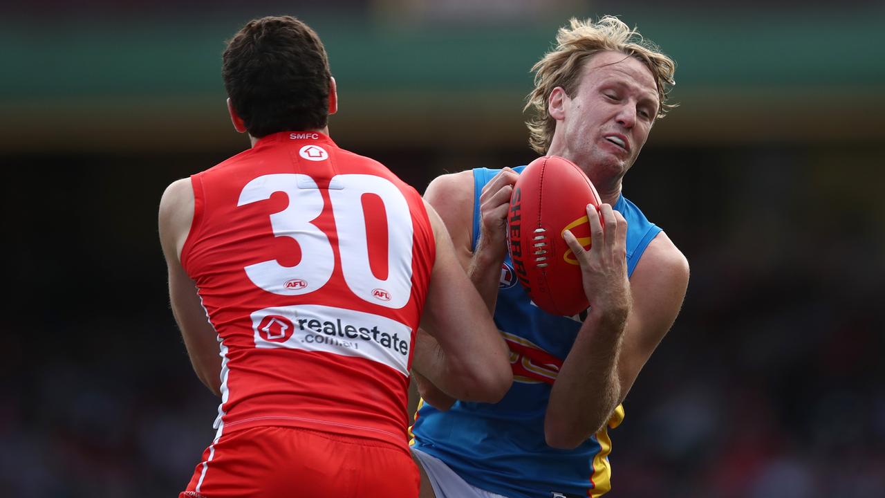 Jack Lukosius of the Suns marks the ball. Picture: Jason McCawley/AFL Photos/via Getty Images