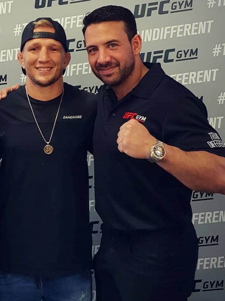 Karim Girgis during his gym’s grand opening in 2018 with UFC fighter TJ Dillashaw.