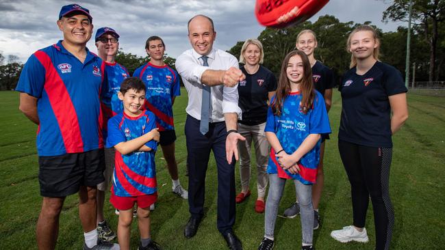 Hornsby MP Matt Kean (middle) has secured $1 million for the construction of a new clubhouse and facilities for the Pennant Hills Demons JAFLC. With Kean are representatives from the club: club president Steve Protogeros, committee member Dean Moran, U17 player Isaac Protogeros, U9 player Xavier Protogeros, U12 player-to-be Zara Protogeros and club registrar Jenni Stewart with youth girls 16 players Anna Stewart and Ciara Richards. Picture: Julian Andrews