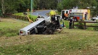 Two men were trapped inside a truck after it rolled at West Woombye on Friday afternoon.