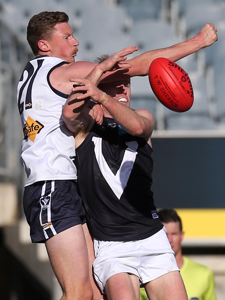 Vic Country’s Brad Ryan and VAFA’s Timothy Harper at Ikon Park, Carlton. Picture: Yuri Kouzmin