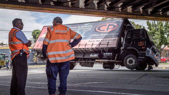 Yarra Trams staff inspecting the site. Picture: Jake Nowakowski