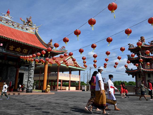 Balinese people following prayers at a Chinese temple on the first day of the Lunar New Year in Denpasar on February 1. Picture: AFP