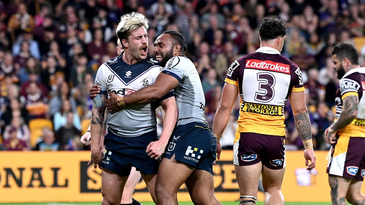 Cameron Munster celebrates scoring one of the Storm's 10 tries against the Broncos. Picture: Bradley Kanaris/Getty Images