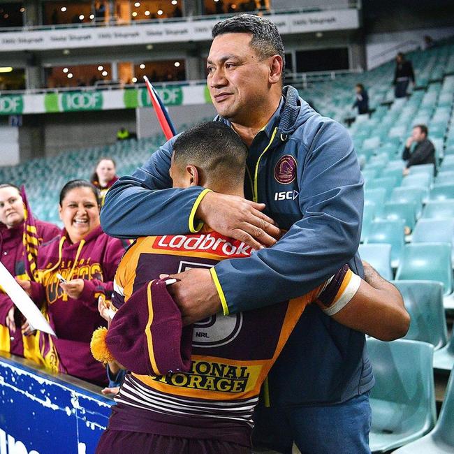 Jamayne Isaako hugs his father Taai after a Broncos game.