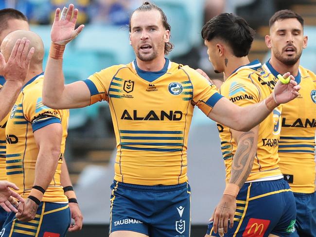 SYDNEY, AUSTRALIA - APRIL 10: Clint Gutherson of the Eells  celebrates scoring a try during the round six NRL match between Wests Tigers and Parramatta Eels at Accor Stadium on April 10, 2023 in Sydney, Australia. (Photo by Mark Metcalfe/Getty Images)