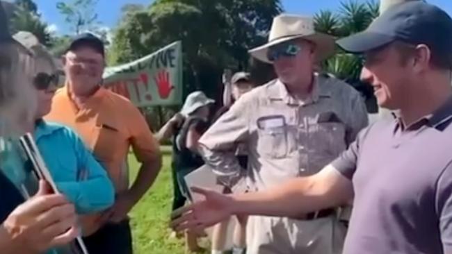 Queensland Premier Steven Miles has a ScoMo handshake moment while visiting Eungella to discuss the Pioneer-Burdekin Pumped Hydro Project. Credit: ABC News