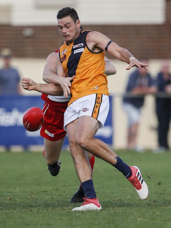 Strathmore coach Nathan Grima gets a kick away. Picture: Valeriu Campan