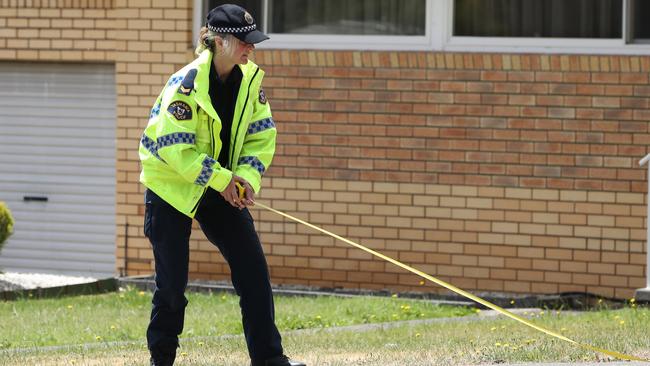 Tasmanian Police crash investigators attend the scene where a teenager riding a motorcycle was killed last night on Harbord Road, Claremont. Picture: Zak Simmonds