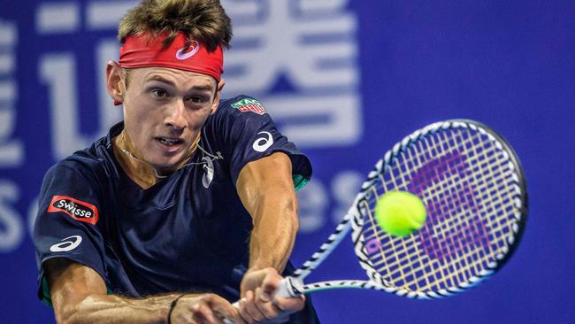 Alex de Minaur flexes his muscle during the men's singles final at the Zhuhai Championships tennis tournament in China in September. Picture: STR / AFP