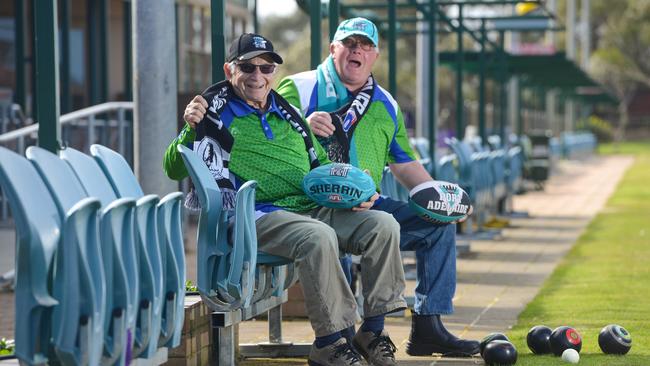 West Lakes Bowling Club members and Power supporters Angelo Salvemini and Dave Pardoe reminisce on the old Football Park seats. Picture: AAP/Brenton Edwards