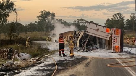 Firefighters at the scene of truck crash that sparked a grass fire on the Bruce Highway north of Gympie on Tuesday afternoon. Photo: Contributed