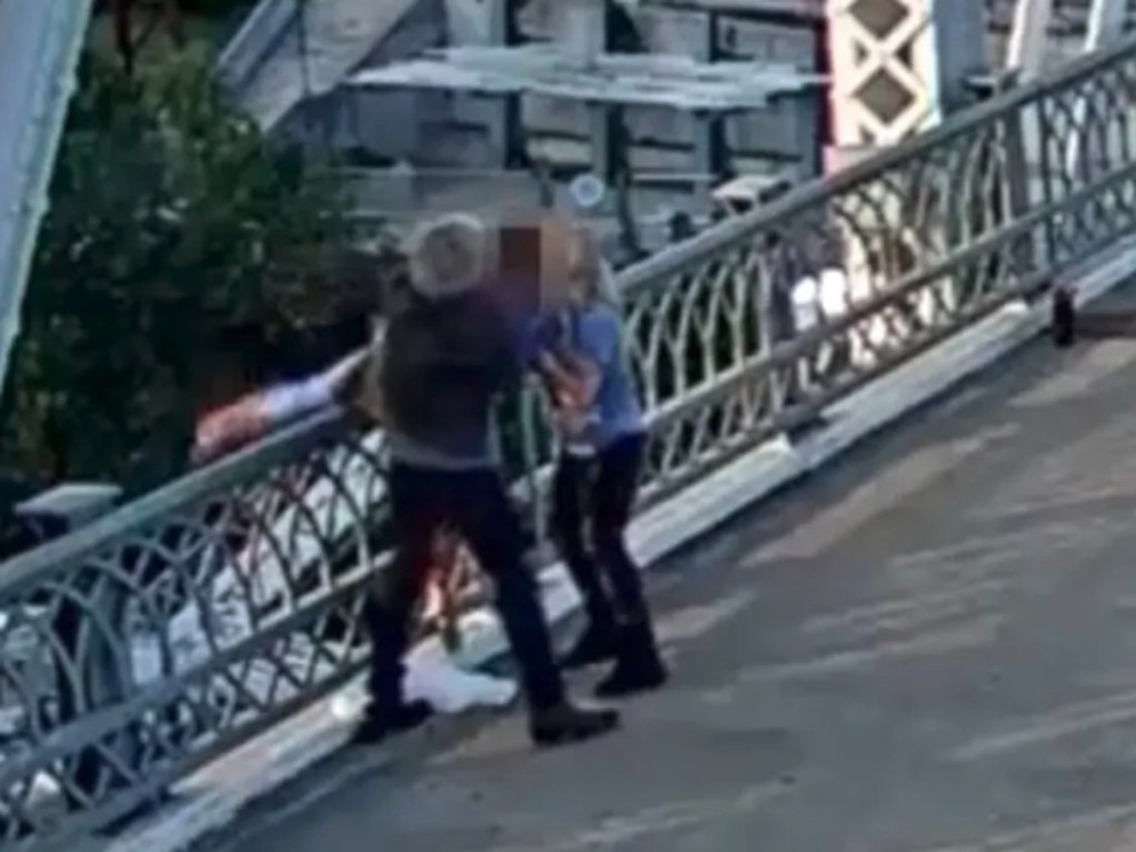 Jon Bon Jovi and a bystander help pull the woman back to safety. Picture: Metropolitan Nashville Police Department