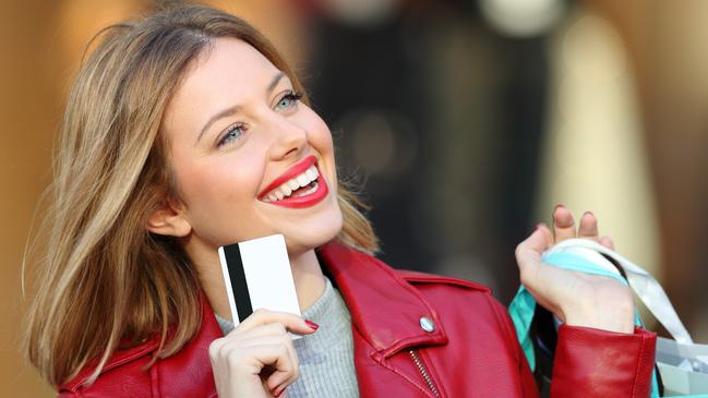 A woman using her credit card to do her shopping. Picture: iStock.