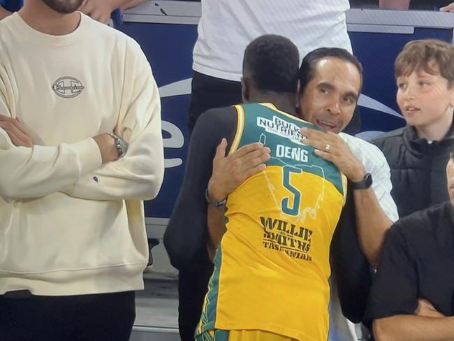 Screengrab of Majok Deng and Eddie Betts hugging after JackJumpers' win in game five of NBL grand final series. Picture: ESPN